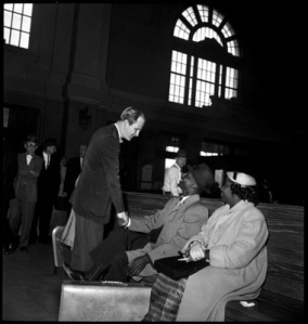 Weaver shaking hands with Shuttlesworth as Shuttlesworth's first wife, Ruby, looks on.  Weaver was on hand at Birmingham's Terminal Station to show support of the couple as they waited in the whites-only waiting room. Credit: Birmingham News/Alabama Media Group