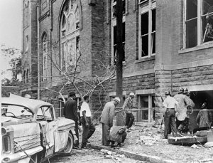 Fire personnel and onlookers view the damage at 16th Street Baptist Church. 