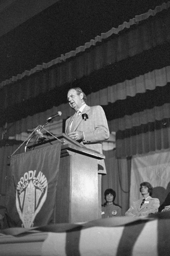 Coach Bear Bryant speaks at Woodlawn High School in 1975
